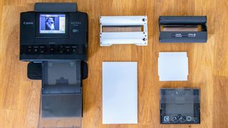 Canon SELPHY CP1300 Wireless Compact Photo Printer being tested in writer's home