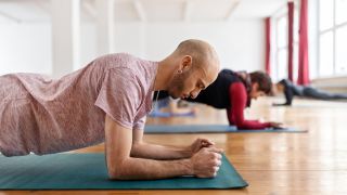 Man in forearm plank position