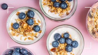 Glass bowls of yoghurt with blueberries and granola, part of the Rosemary Conley diet plan