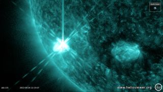 solar flare glowing on sun in green filter