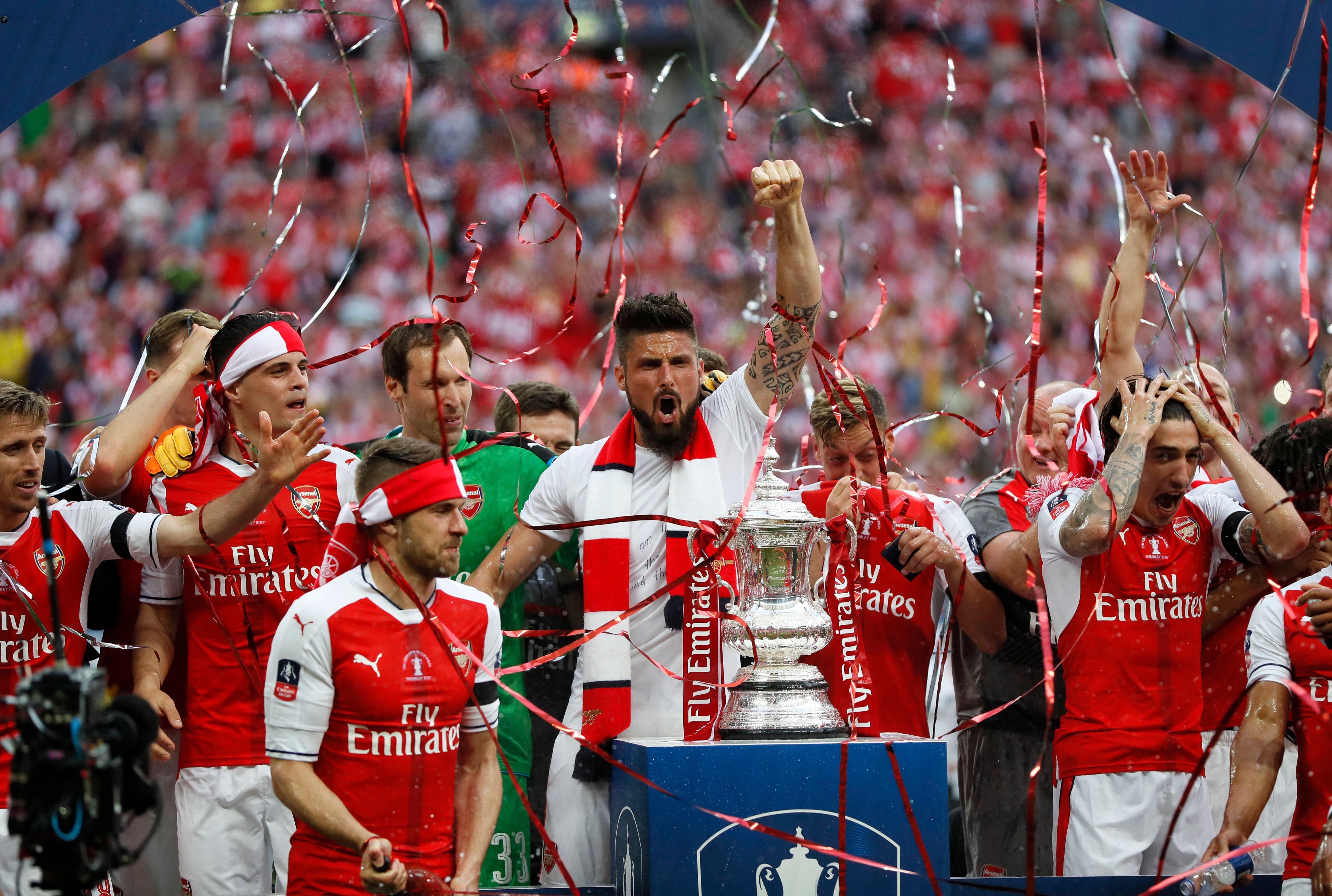 Arsenal players celebrate with the FA Cup after winning the 2017 final against Chelsea at Wembley