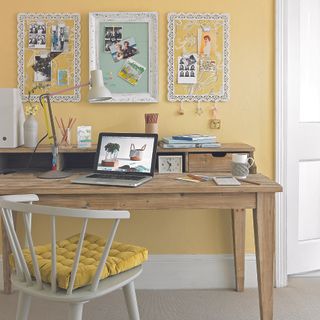 room with wooden table and frame