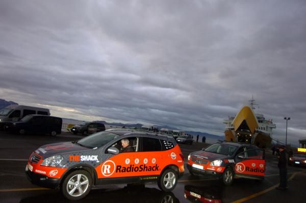 RadioShack's team cars disembark after the ferry ride from Livorgno