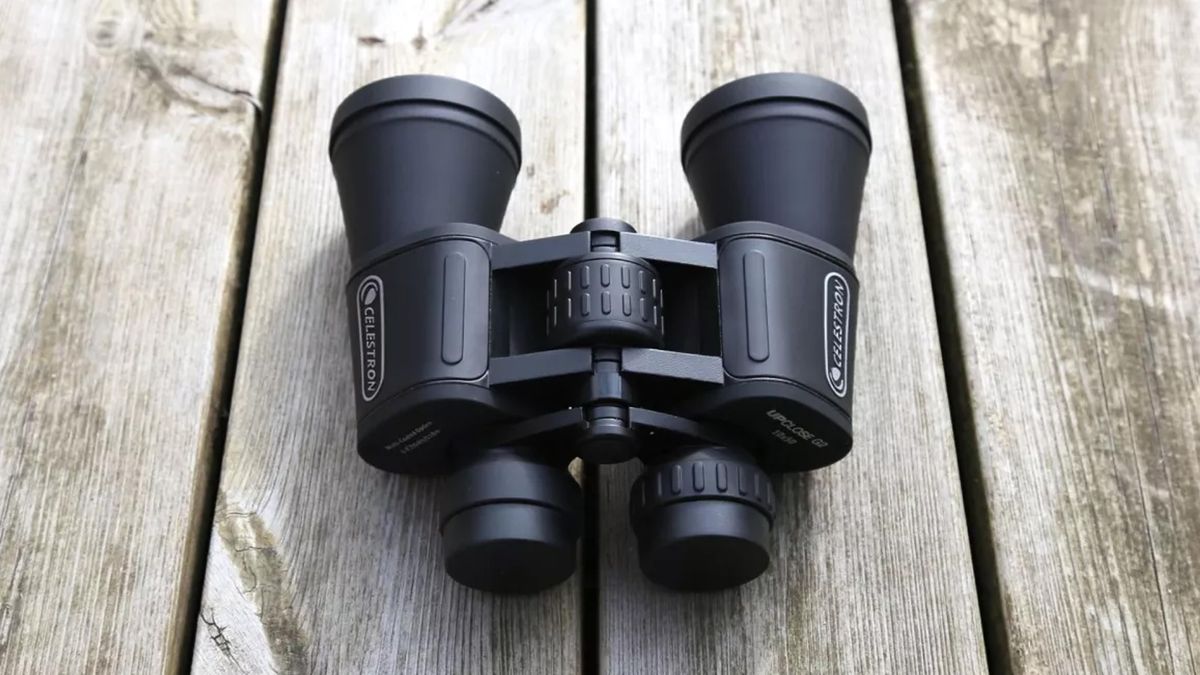 Celestron UpClose binoculars on a wooden table