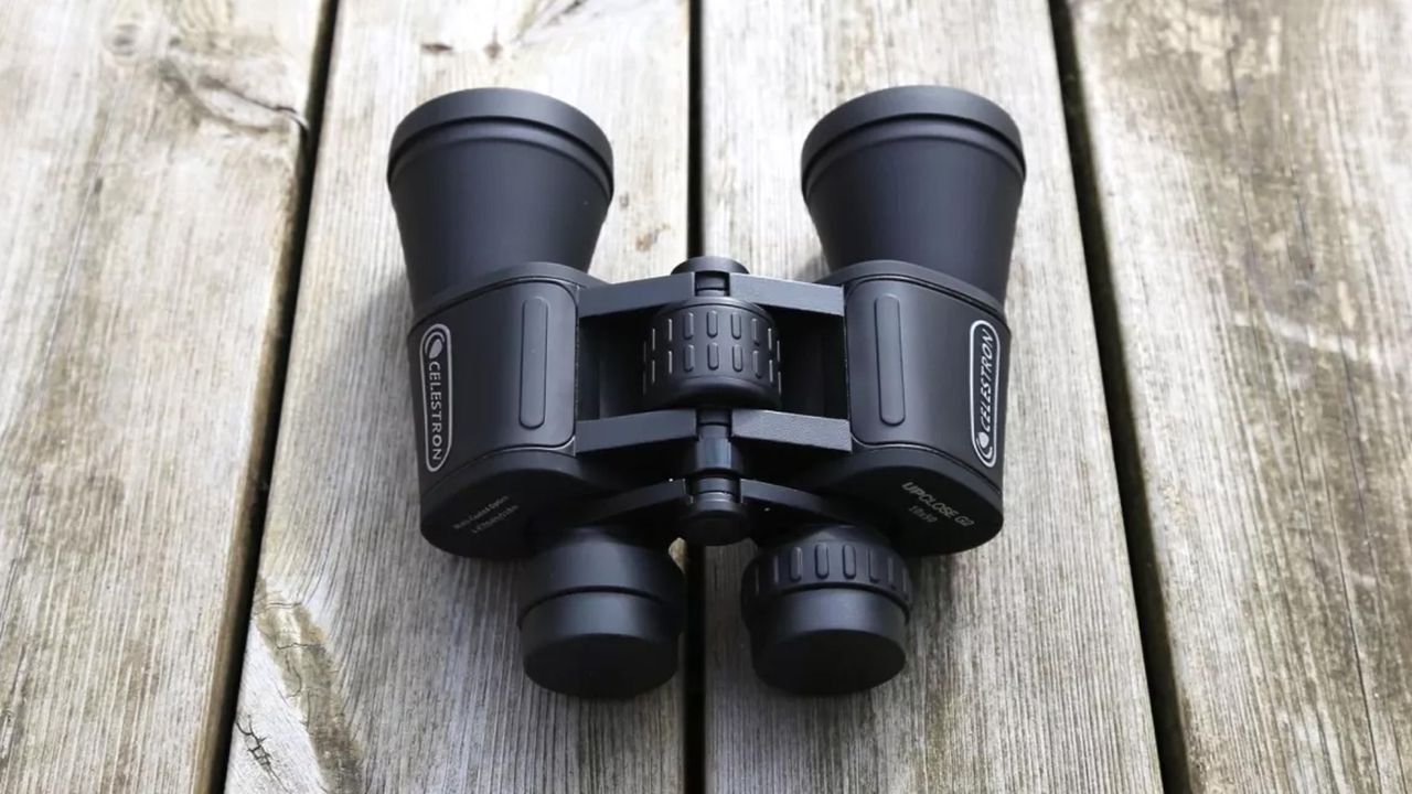 Celestron UpClose binoculars on a wooden table