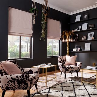 living area with black wall and open shelves