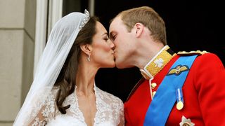 Prince William, Duke of Cambridge and Catherine, Duchess of Cambridge kiss on the balcony of Buckingham Palace after getting married on April 29, 2011 in London, England.