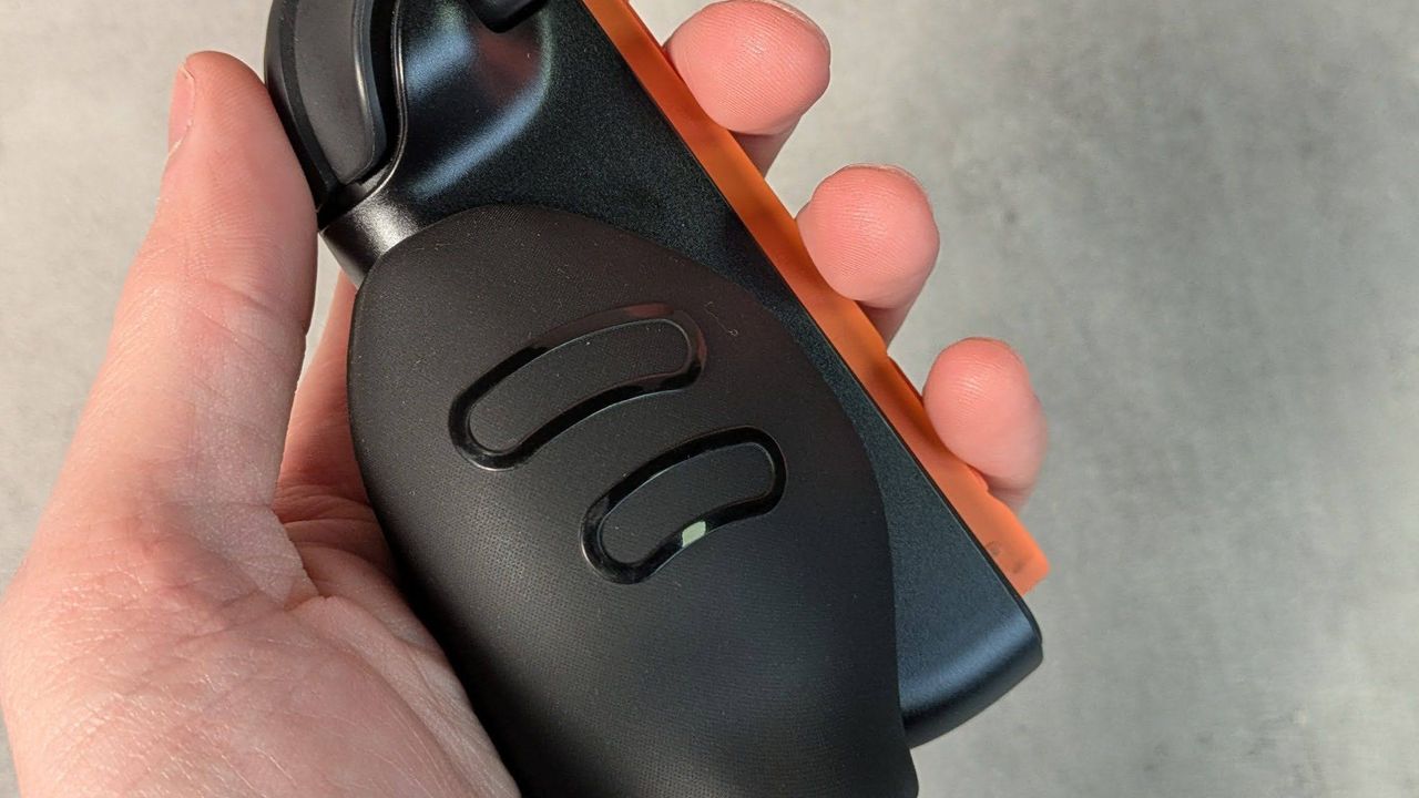 Genki Attack Vector grip on joy-con 2, held in hand