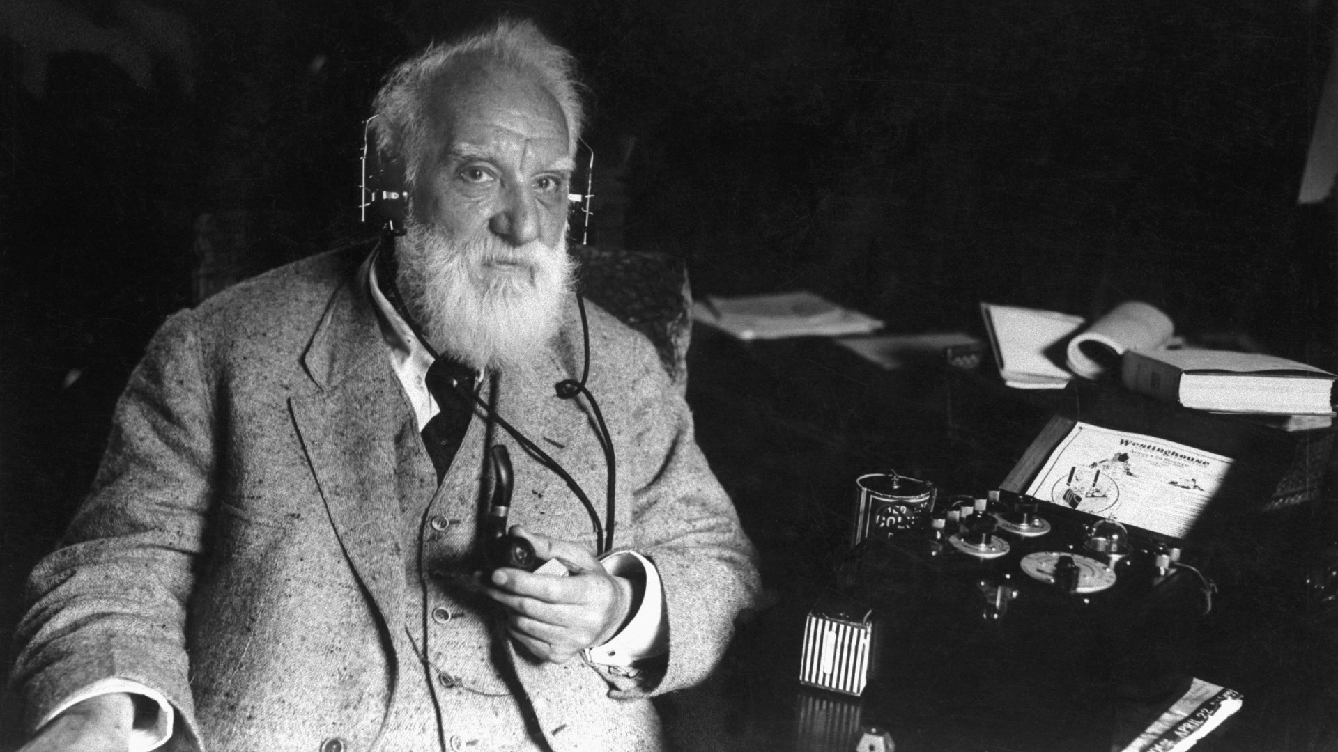 American inventor Alexander Graham Bell (1847-1922) with one of his inventions, ca. 1910. Bell engineered the first intelligible electronic transmission of voice and patented the telephone, and was a founding member and president of the National Geographic Society.