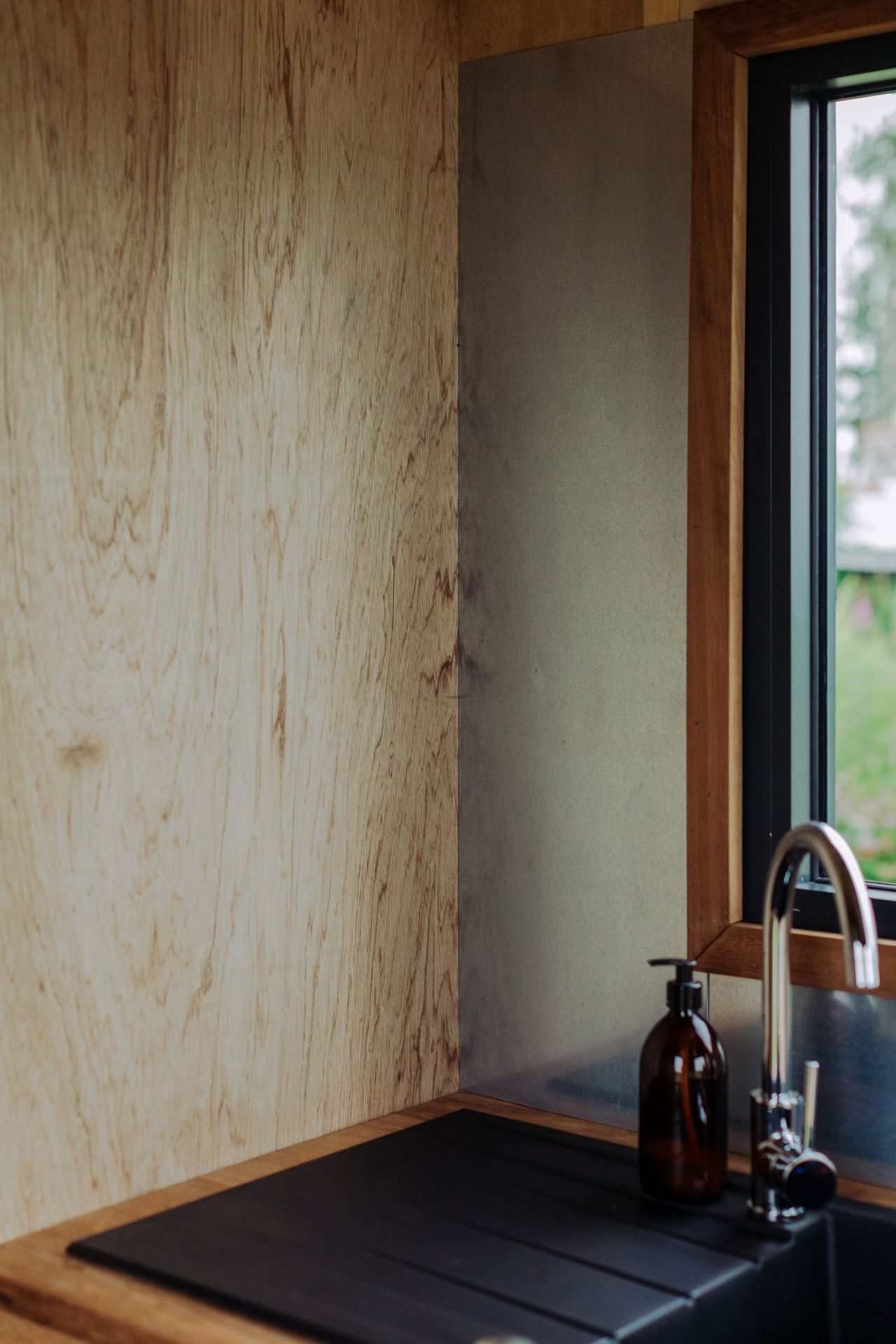 The wooden panelling on the wall of the tiny eco home