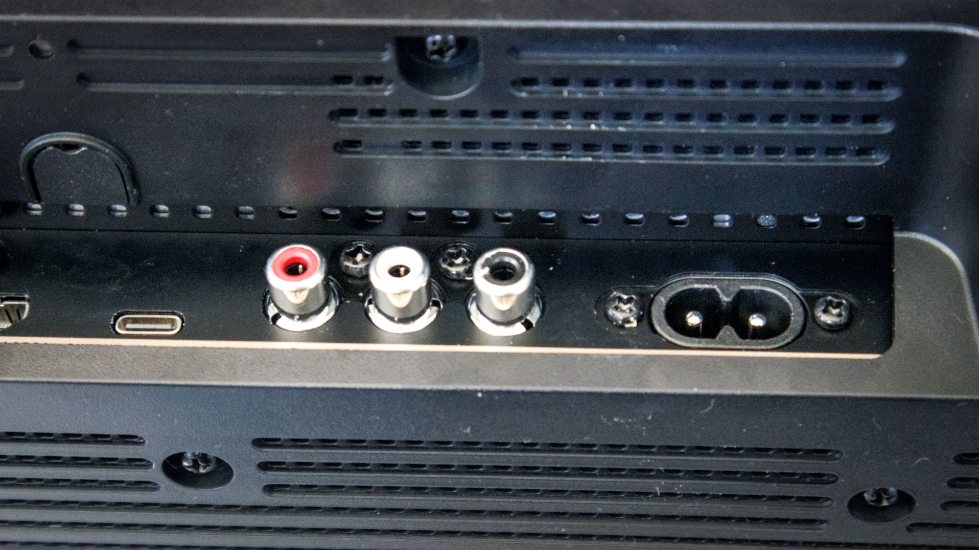 The ports on a Marshall Heston 120 soundbar on a TV stand.
