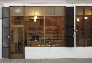 The shop front of The Good Liver lets passersby peek inside the store and its filled-up wooden shelves displaying all sorts of home goods.