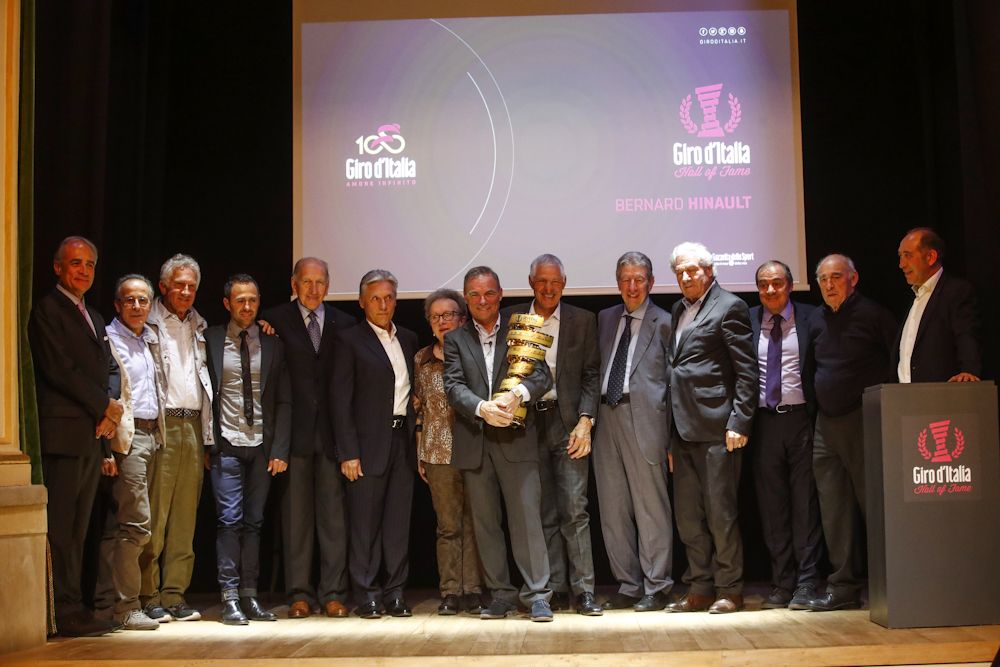dignitaries crowd the stage for Bernard Hinault's Giro Hall of Fame induction ceremony