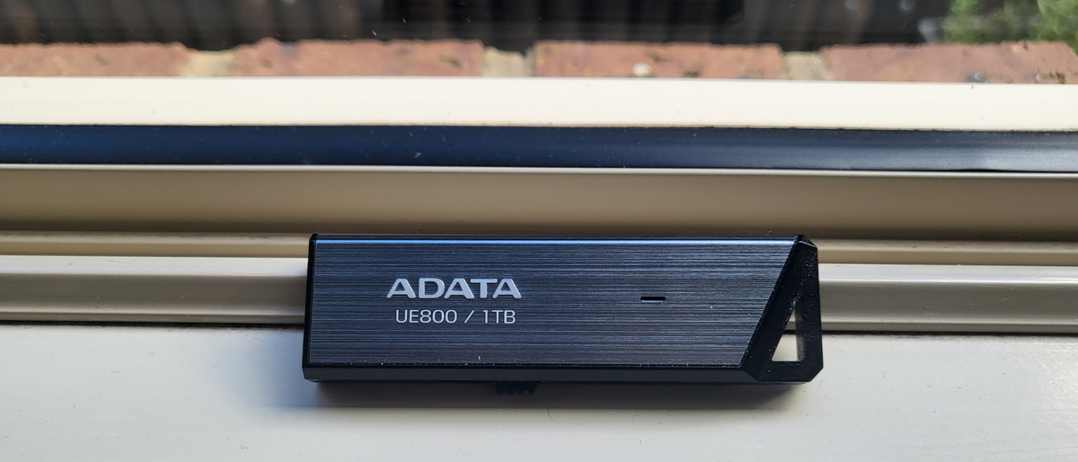 Adata UE800 1TB SSD on a window sill during our test and review process