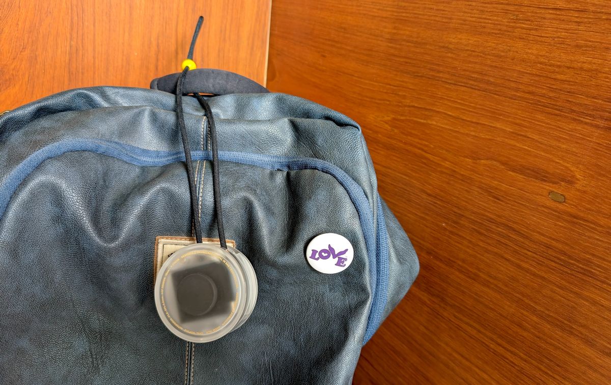 Opal Tadpole webcam in protective case attached to backpack
