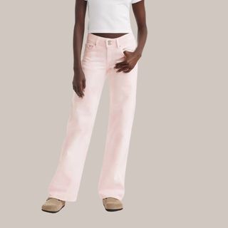 flat lay image of pink jeans 