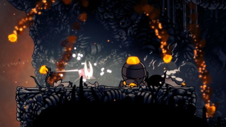 Hornet attacks a rock-like bug that spews lava in Hollow Knight: Silksong