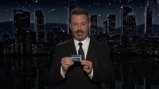 Jimmy Kimmel holding up a Blockbuster card on Jimmy Kimmel Live!