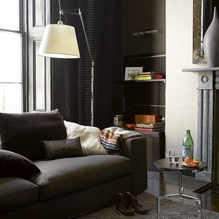 living room with grey sofa and lamp