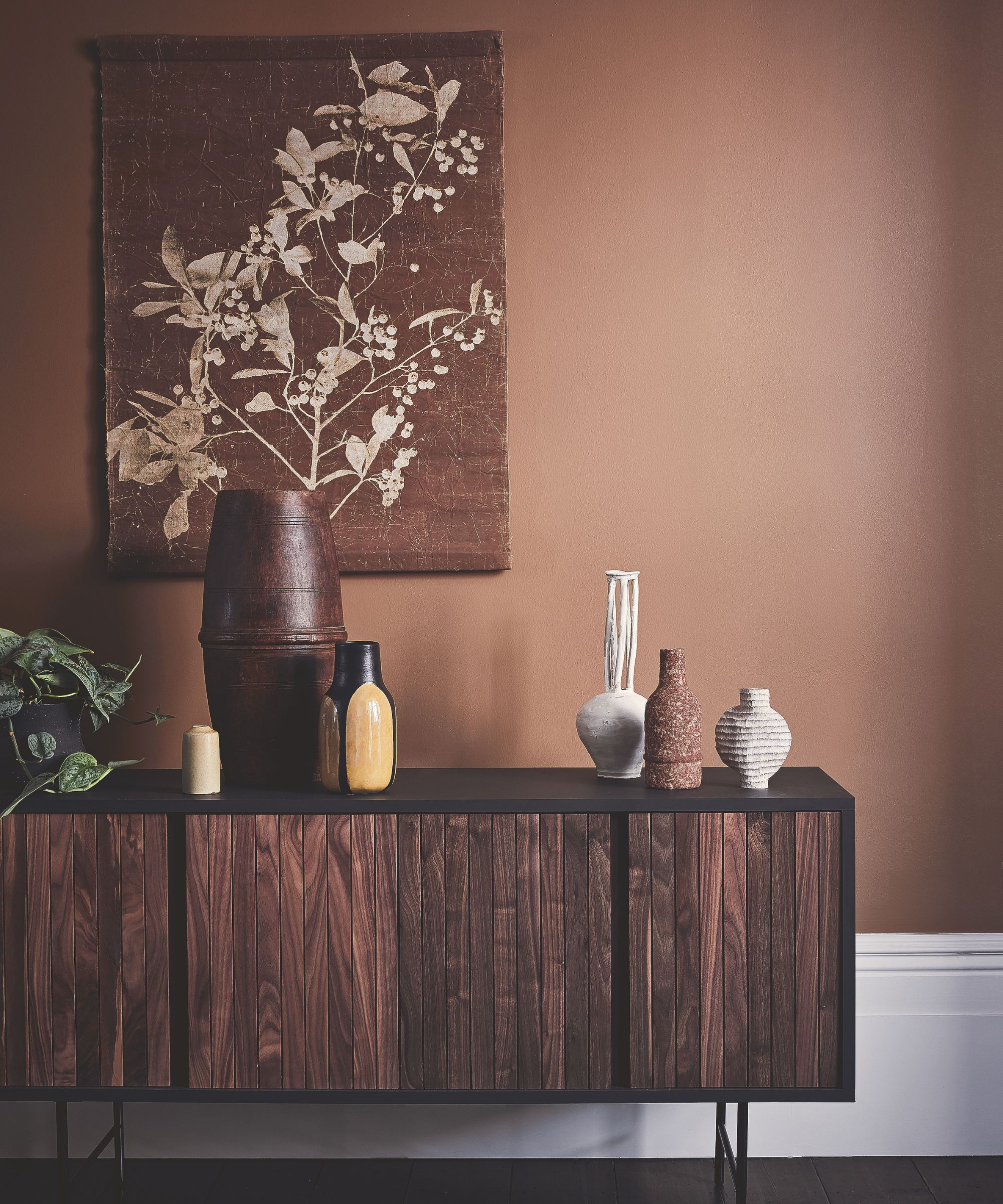 Dark wood console table in toffee-colored living room
