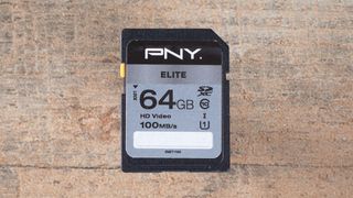 PNY Elite UHS I, one of the best SD cards, on a wooden surface