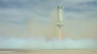Blue Origin's New Shepard booster approaches its landing zone after launching the NS-15 suborbital test flight of the company's RSS First Step capsule on April 14, 2021.