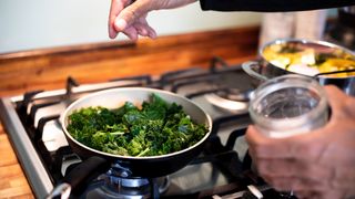 Kale cooking in a frying pan