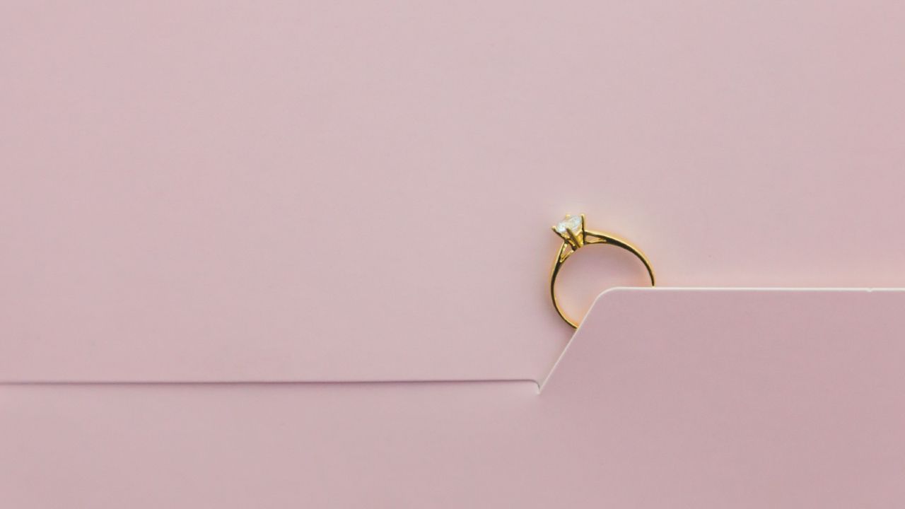 engagement ring on pink background