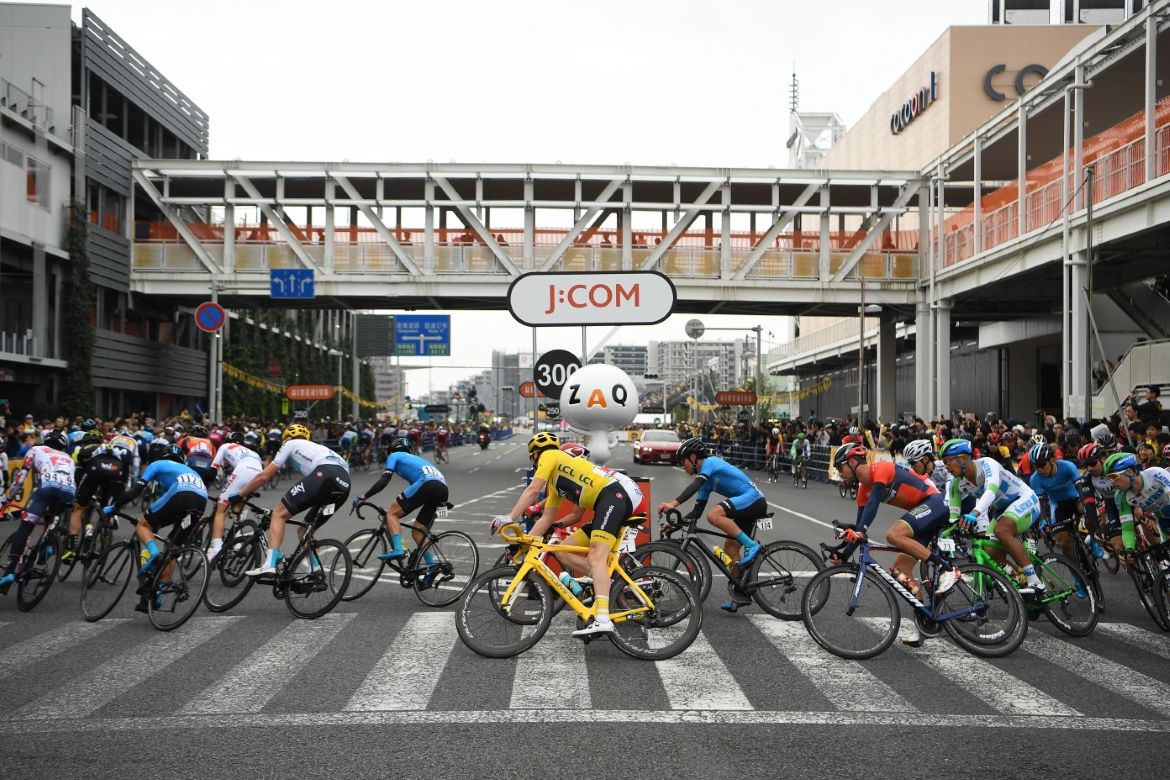 The riders round a corner