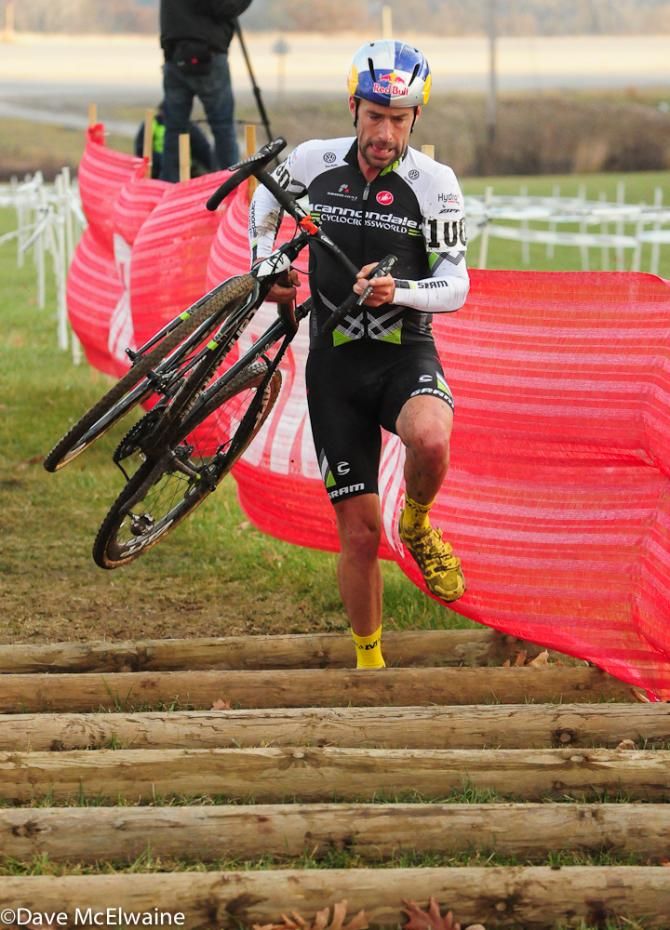Tim Johnson (Cannondale Cyclocrossworld.com) crossing the log barriers for the last time
