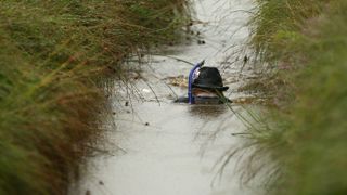 competitor takes part in the World Bog Snorkelling Championships held at Waen Rhydd Bog