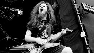 Dimebag Darrell performing onstage in 1994