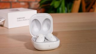 The samsung galaxy buds live earbuds in white in their charging case