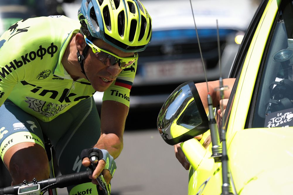 Alberto Contador speaks with his team director during stage 9
