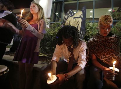 Protesters hold candles for Walter Scott in front of city hall in North Charleston, South Carolina.