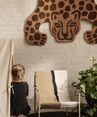 Brown large leopard rug on wall in small children's bedroom idea