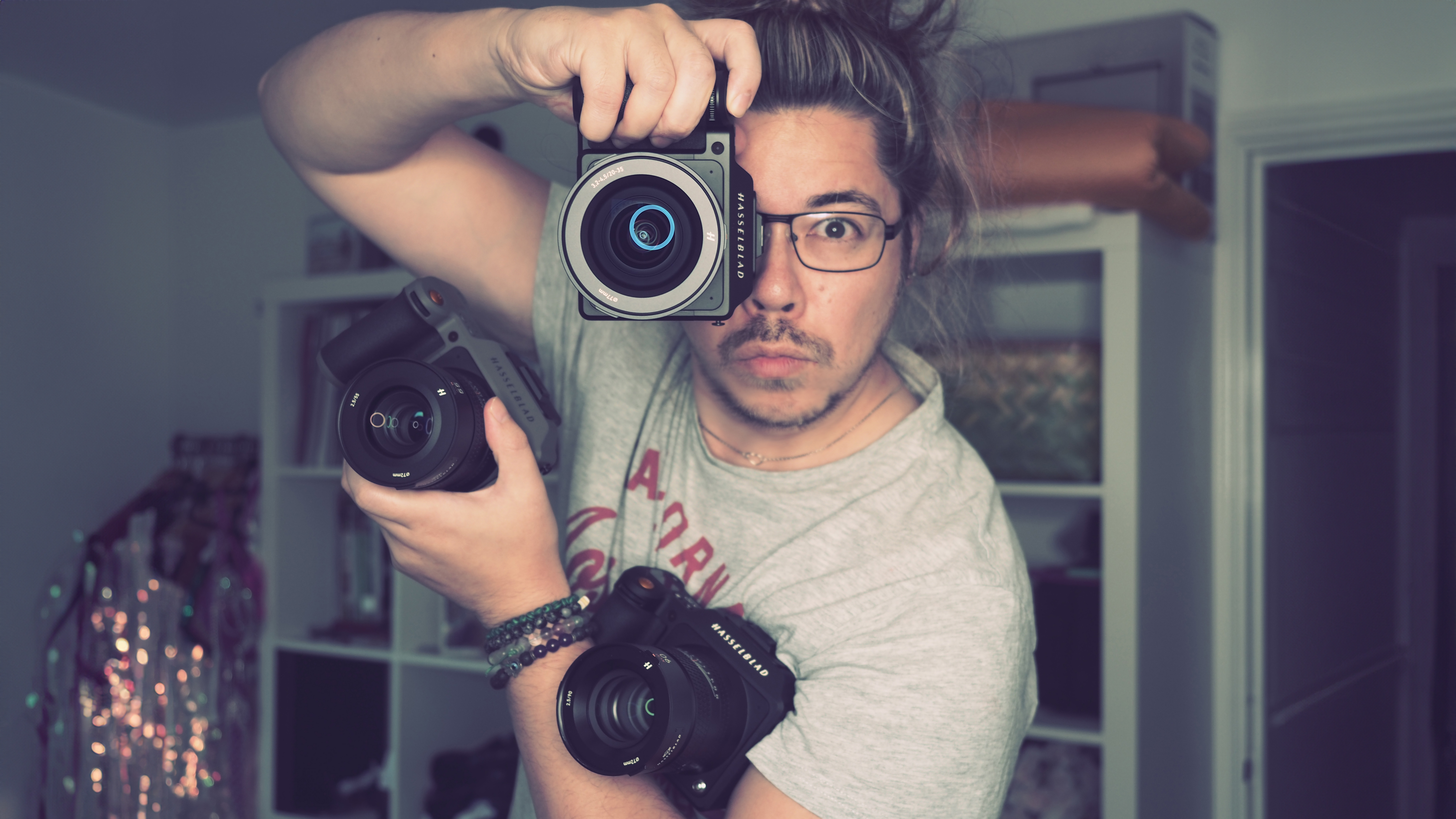 James Artaius clutching a trio of Hasselblad X System cameras