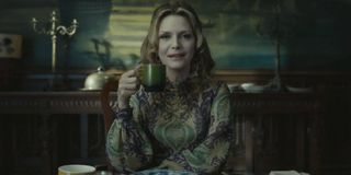 Michelle Pfeiffer holding a cup in Dark Shadows