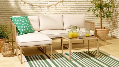 Tesco Florence modular outdoor sofa set on patio with cushions and decorations
