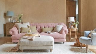cream living room with pink sofa