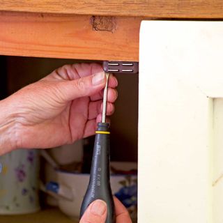 Fixing cupboard door catch