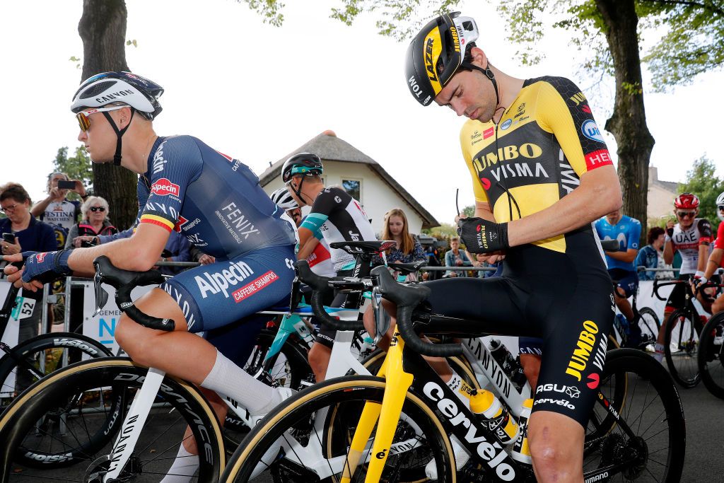 DOKKUM NETHERLANDS AUGUST 30 LR Tim Merlier of Belgium and Team AlpecinFenix and Tom Dumoulin of Netherlands and Team Jumbo Visma prepare for the race prior to the 17th Benelux Tour 2021 Stage 1 a 1696km stage from Surhuisterveen to Dokkum BeneluxTour on August 30 2021 in Dokkum Netherlands Photo by Bas CzerwinskiGetty Images