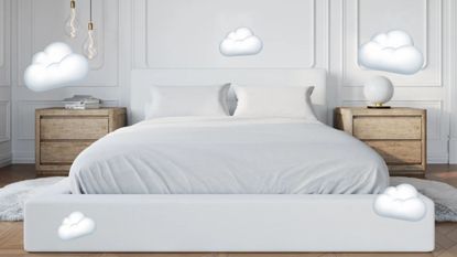 A white upholstered bed with cloud emojis around it