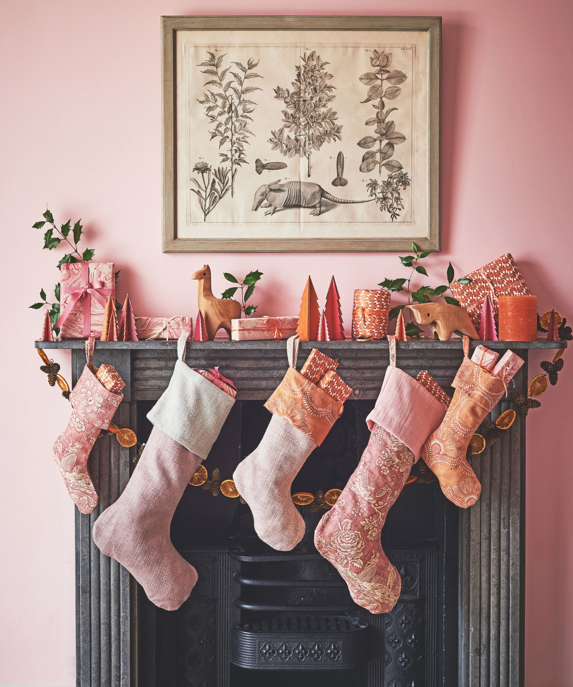 Pink living room with black fireplace and pink stockings