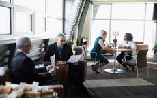 people sitting at posh airport lounge