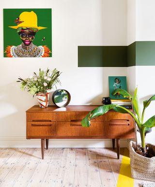 Wooden sideboard in colourful living room of east london victorian terrace