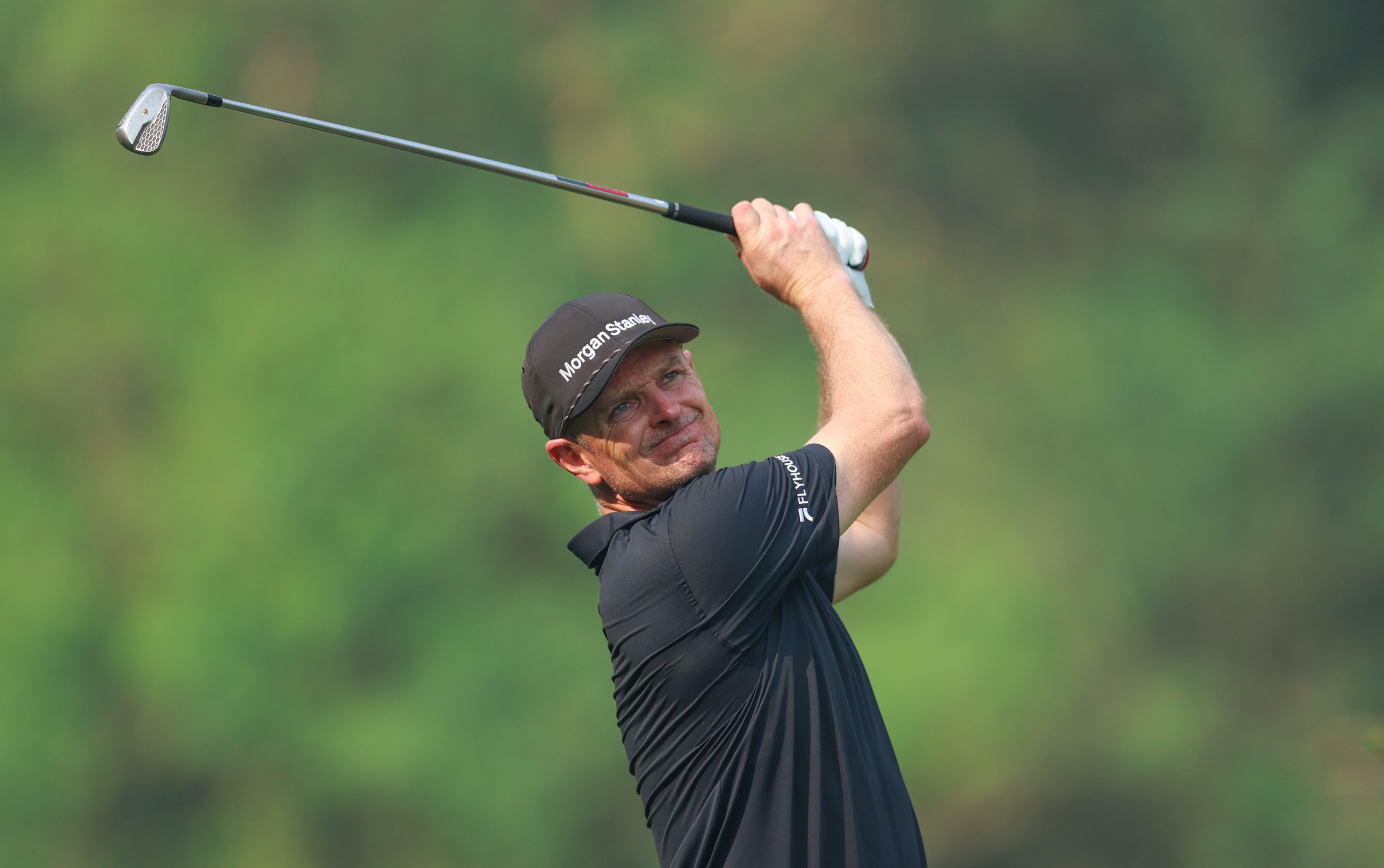 Justin Rose holds his finish on an iron shot