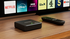 Manhatten TV Aero 4K TV Streamer with Freely &ndash; box in lifestyle shot