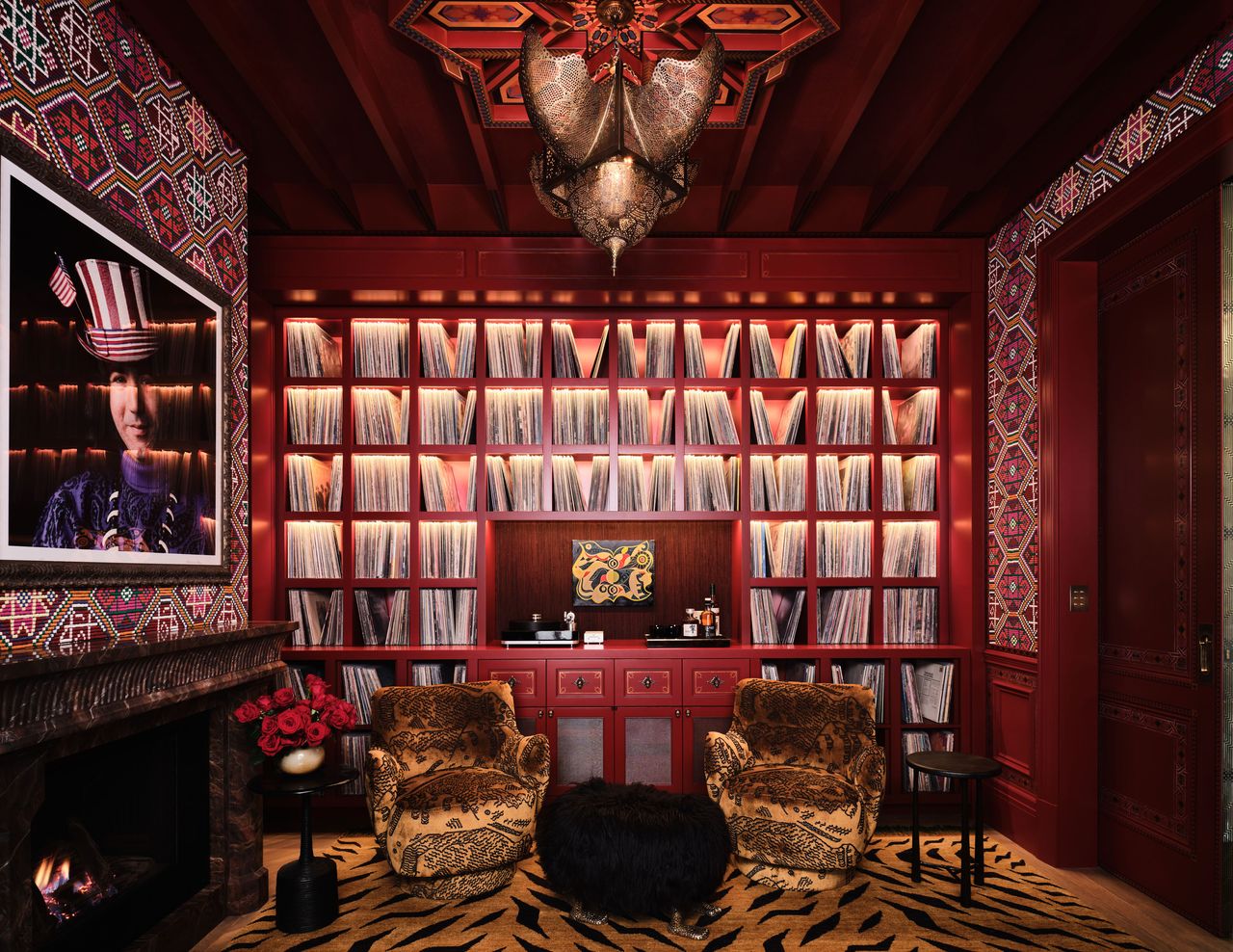 a maximalist library with animal print rug