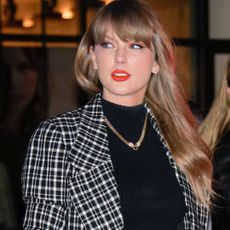 Taylor Swift arrives at Chez Margaux in a Carolina Herrera outfit